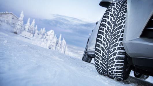 Vehicle with studded winter tires